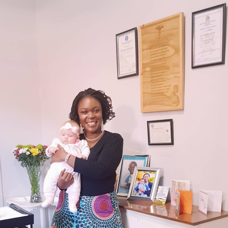 Dr Chiwanga with a baby patient at the clinic